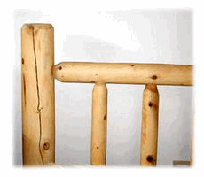 A wooden bedpost with a split that's part of checking