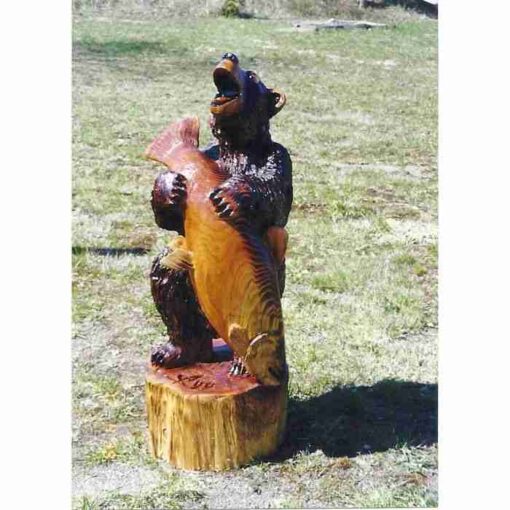Bear with fish chainsaw carving stump sculpture